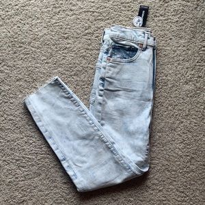 High waisted acid wash raw hem jeans